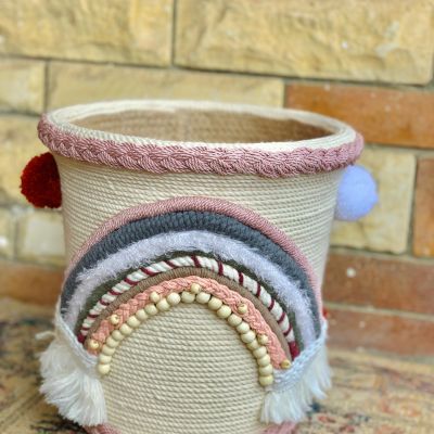 Basket with macrame threads