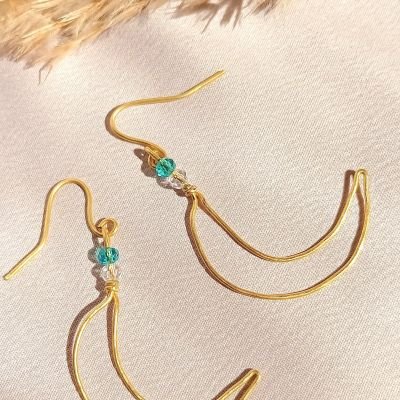 اقراط نحاس على شكل هلال 