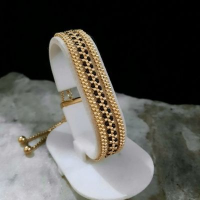 مجموعة رقيقة من الذهبى والأسود ( إسورة وخاتم ) من خرز الميوكى