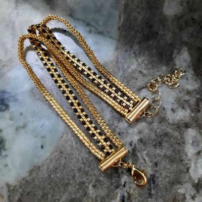 مجموعة رقيقة من الذهبى والأسود ( إسورة وخاتم ) من خرز الميوكى