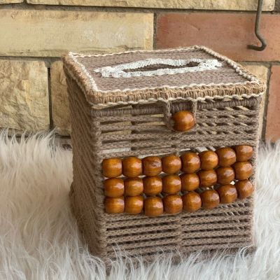 A box of tissues with macrame cordon