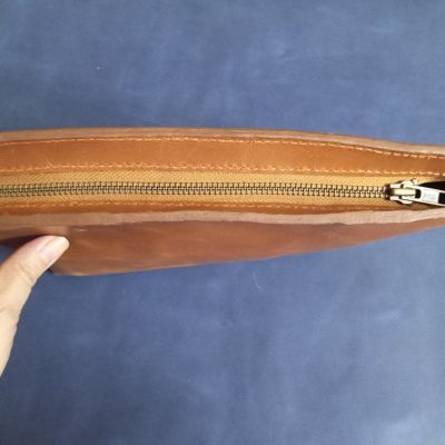 Genuine leather bag, hand engraved and hammered