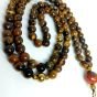 A 99-bead prayer necklace made from tiger eye stones.