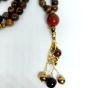 A 99-bead prayer necklace made from tiger eye stones.