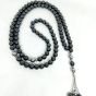 A 99-bead prayer necklace made from hematite stones.
