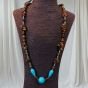 A necklace made of tiger's eye and turquoise stones.