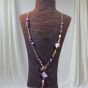 The necklace is made of amethyst stones.