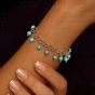 Silver bracelet inlaid with turquoise stones
