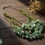 Holding shades of green necklace