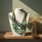 Holding shades of green necklace