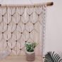 Macrame wall hanging with shelf 