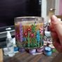 Glass mug with flowers 