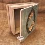 “Wooden box adorned with raised Russian floral designs