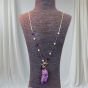 The necklace is made of amethyst stones.