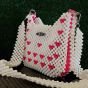  شنطة خرز ابيض * فوشيا قلوب 