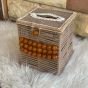 A box of tissues with macrame cordon