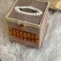 A box of tissues with macrame cordon