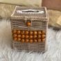 A box of tissues with macrame cordon